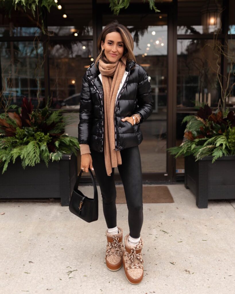 Karina wears black puffer moncler jacket and ysl handbag