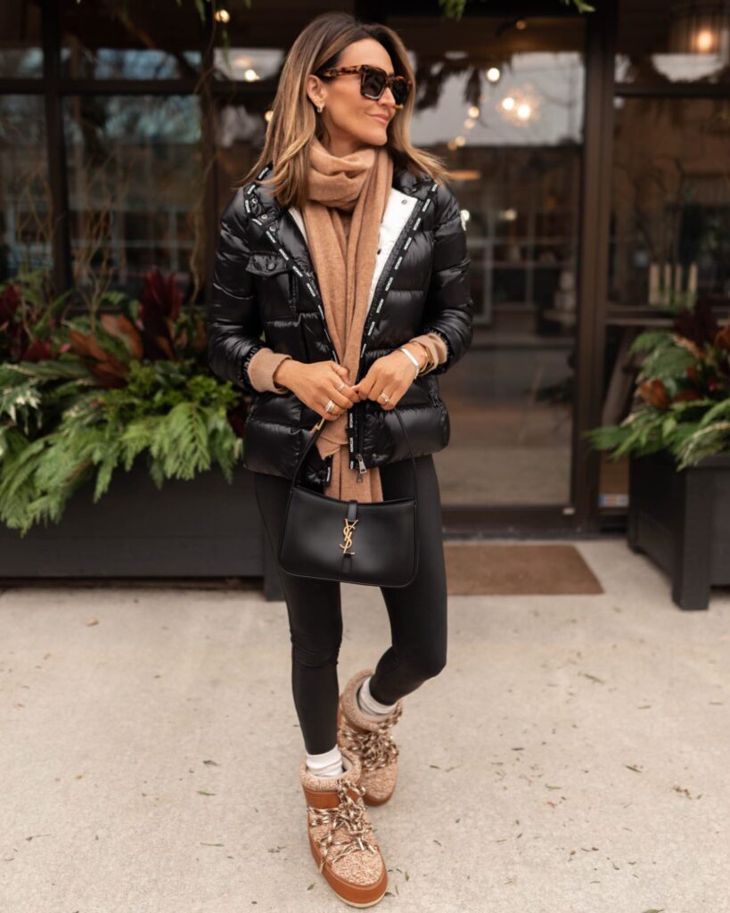 Karina wears black puffer moncler jacket and ysl handbag