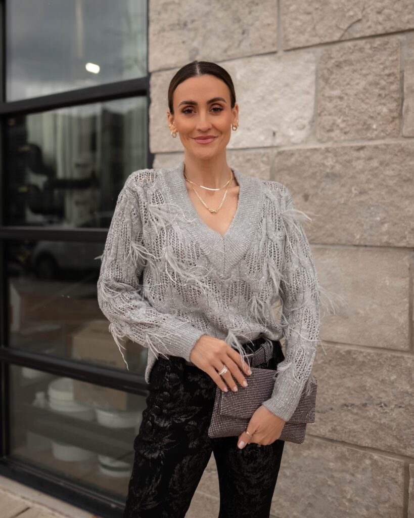 Karina wears WHBM feather and sequin sweater with floral pant