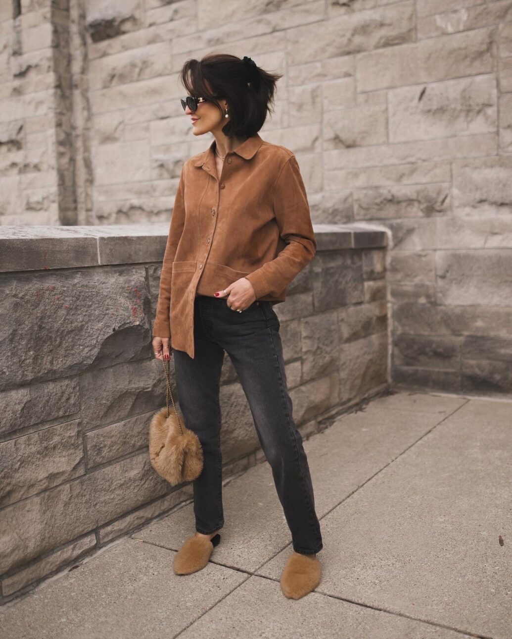 black jean outfit with brown suede button up shirt and slides