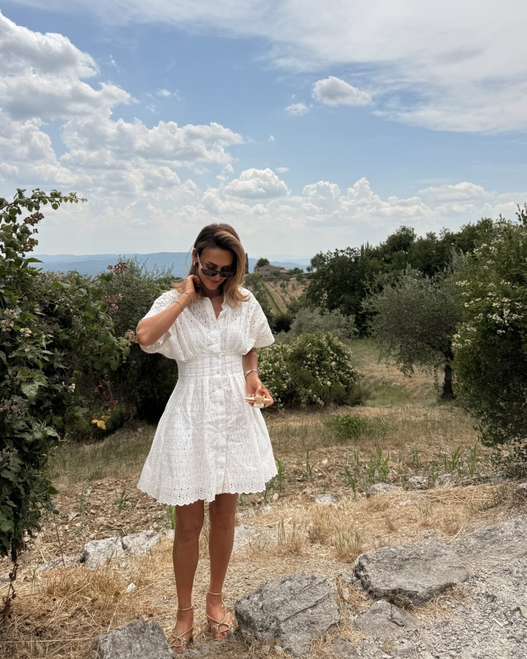 eyelet little white dress, sezane gold sandals, sezane basket bag, shimmer tanning lotion, miu miu sunnies, what to wear in tuscany 