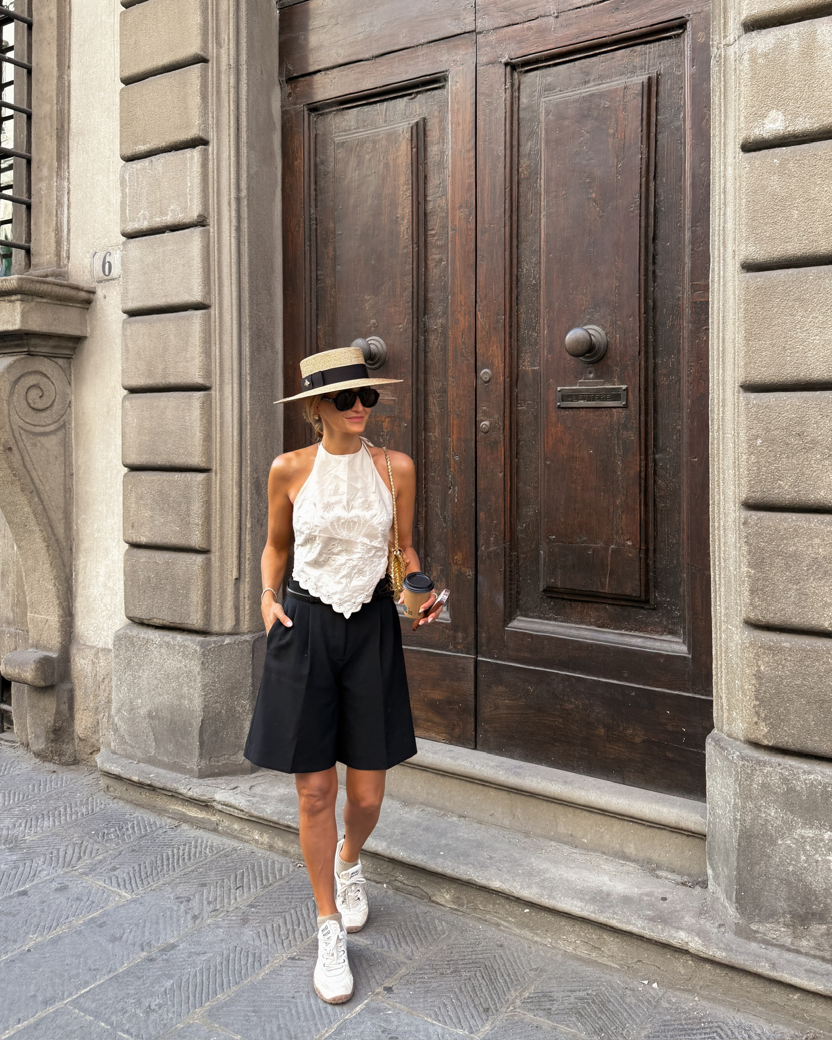 Poplin Zara open back top, gold buckle belt, Miu Miu sneakers, Gucci gold raffia hat, Celine sunnies. 