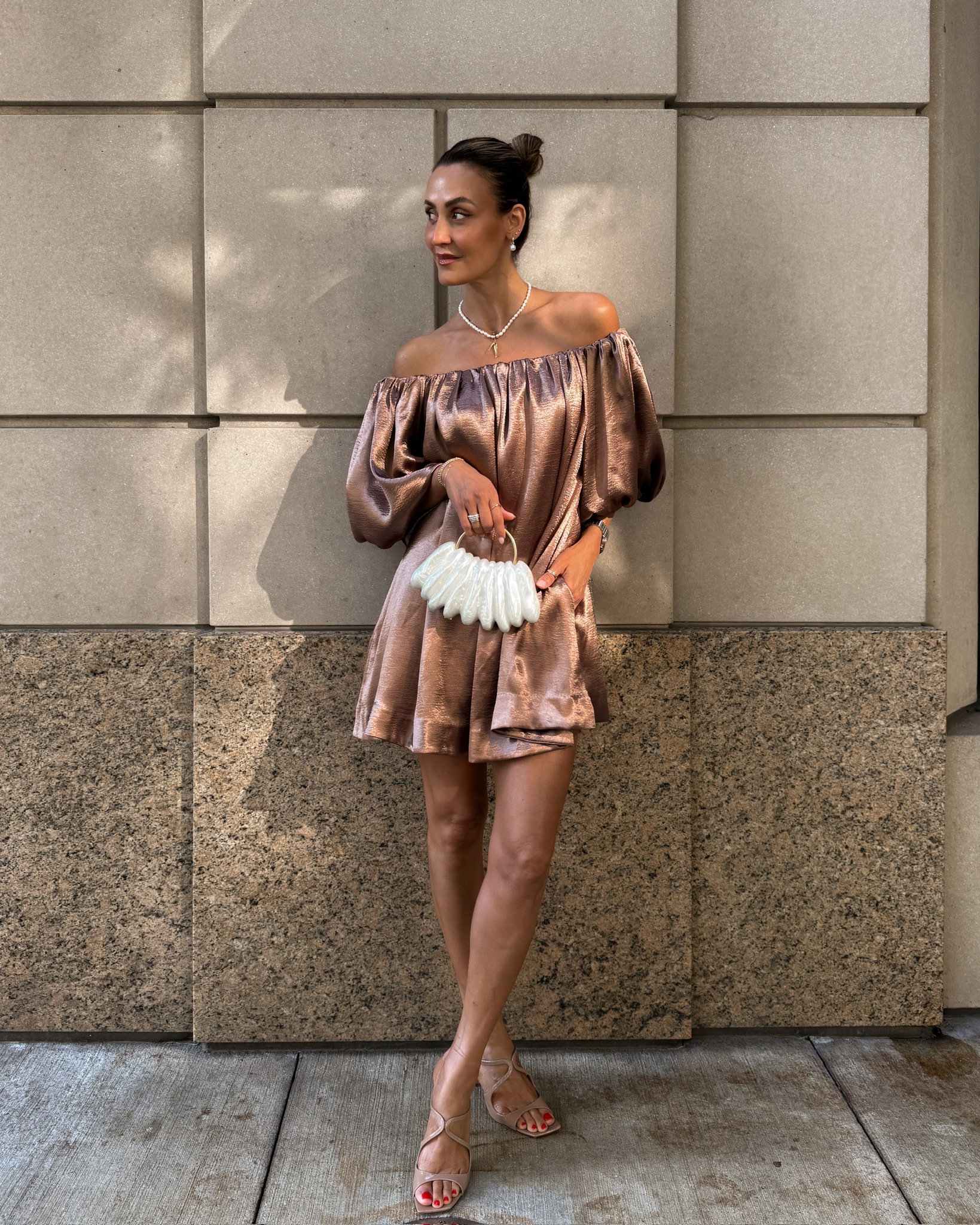 Shimmery brown Anthro x heynasreen strapless dress, Zara white shell clutch, Jimmy Choo brown heels, J. crew pearl  and fish necklace, Anthro pearl earrings, summer date night outfit