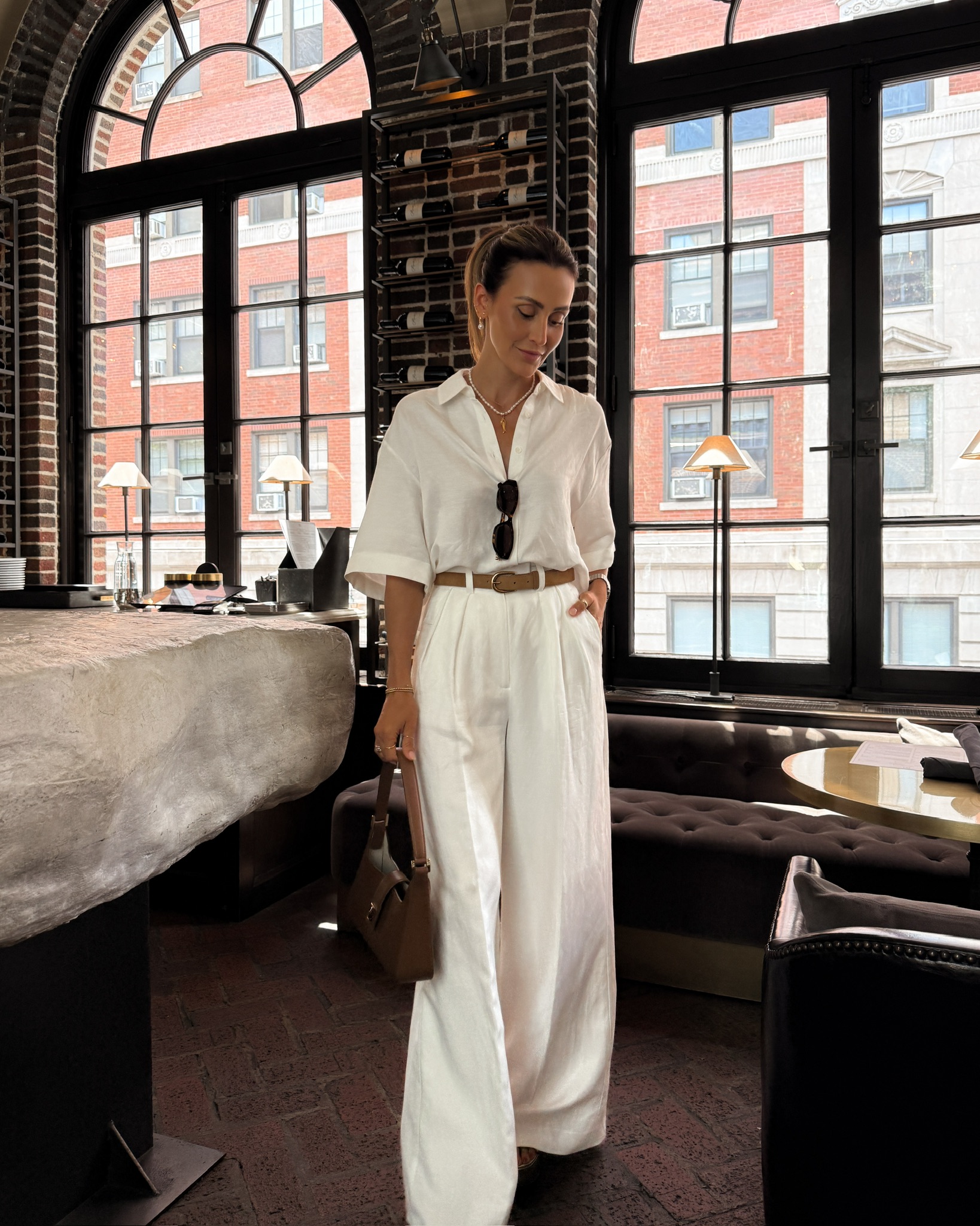 Anine Bing Coco shirt, white Lou trousers, brown belt, brown leather shoulder bag with gold accents, Miu Miu sunnies, J. Crew pearl and fish necklace, Jeffery Campbell brown heels