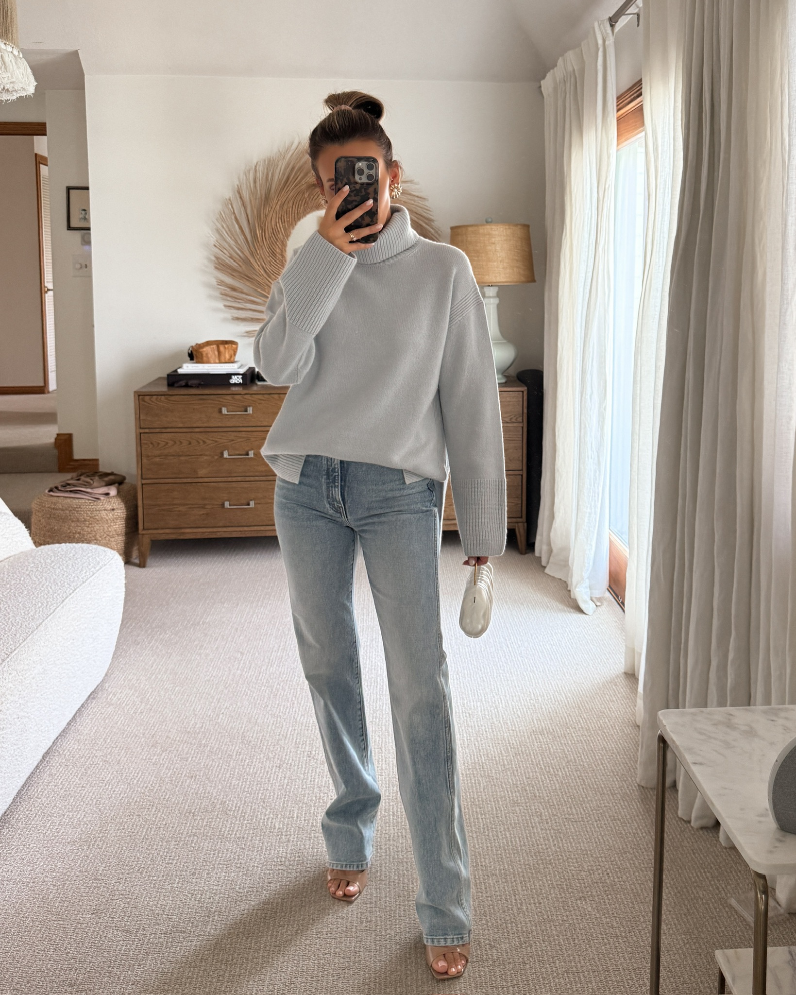 baby blue turtleneck cashmere sweater, high rise slim fit straight jeans, open toe tan sandals, white clutch, fall chic outfit